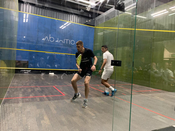 Miles Jenkins on court in Weybridge with Abhay Singh