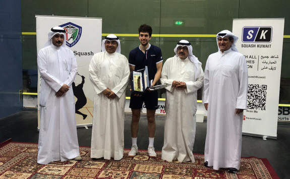 Auguste Dussourd collects the trophy at the 1st Kuwait International Squash Championship