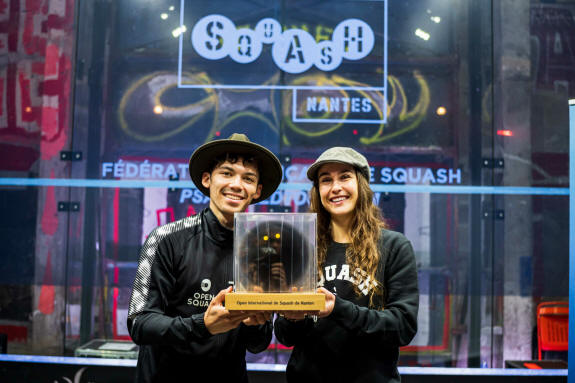 Victor Crouin and Nele Gilis with the Open de France de Squash trophy