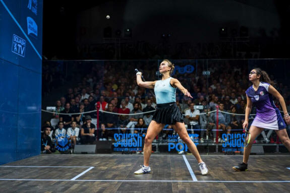 Tinne Gilis plays a forehand volley during her match with Fayrouz Aboelkheir